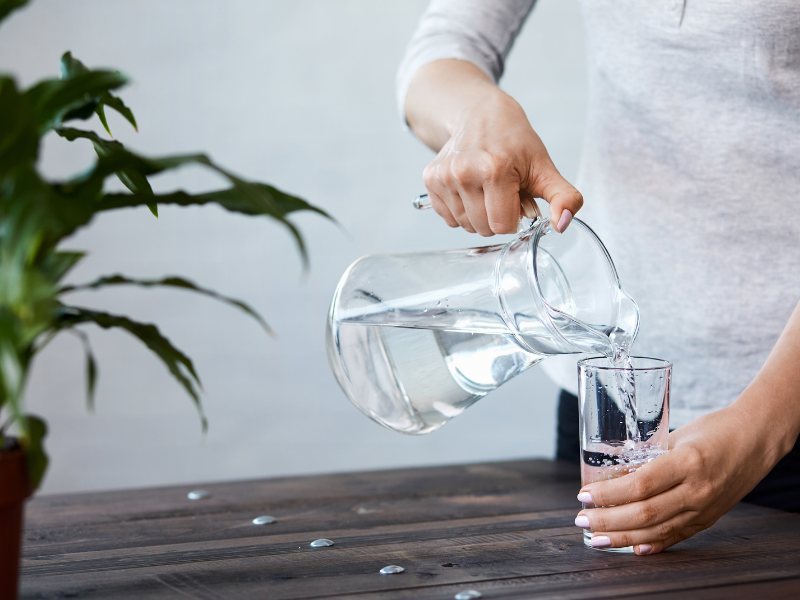 What are the health benefits of drinking sufficient water daily?